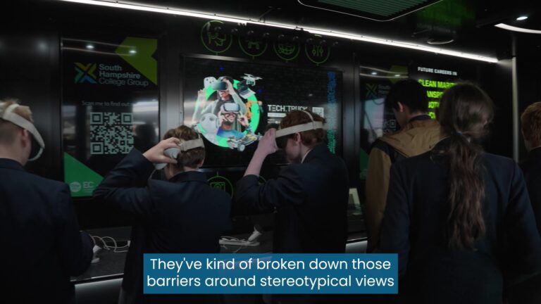Looking at the back of school children at a careers event. They are wearing Virtual Reality (VR) headsets.